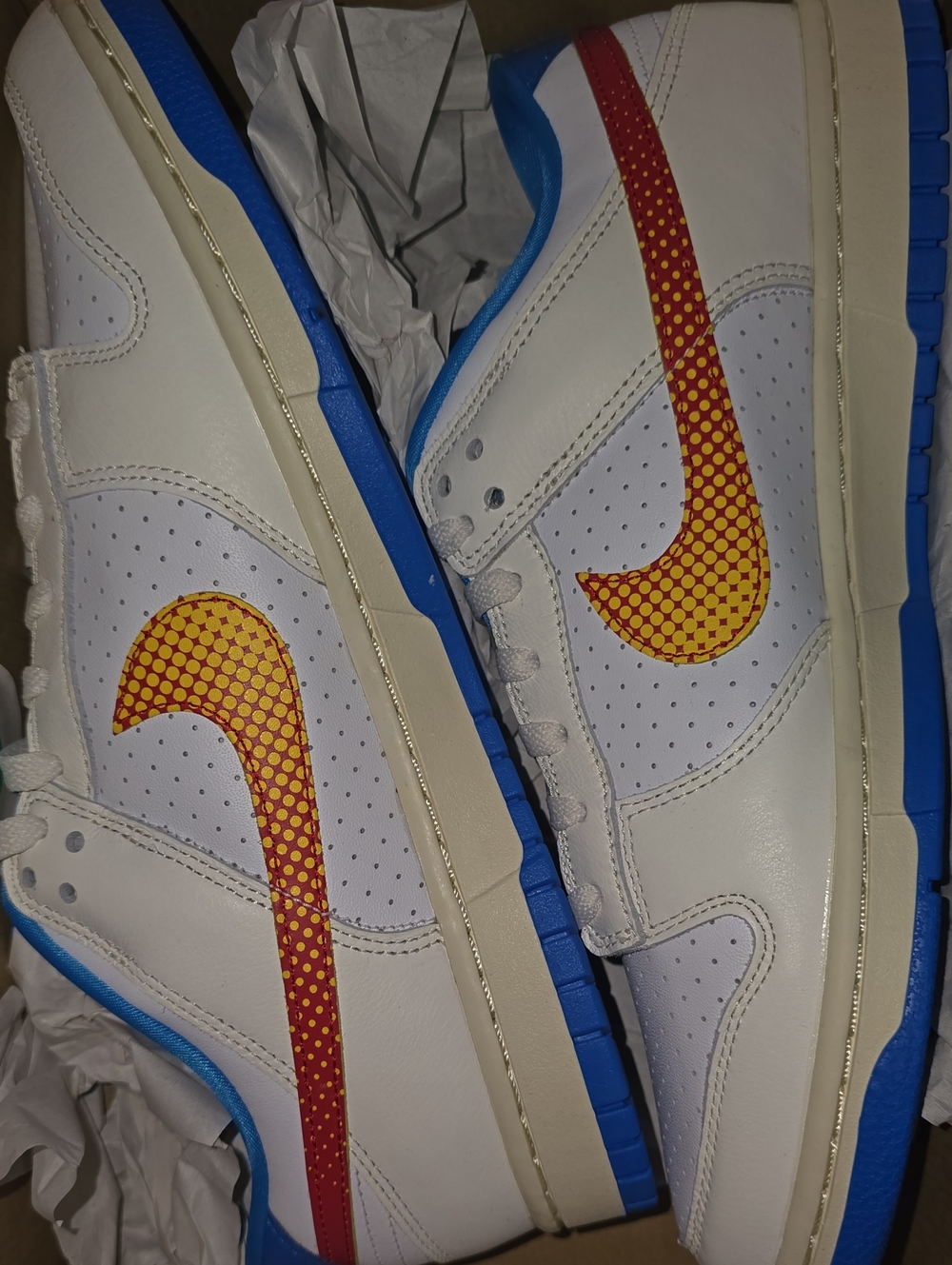 Nike White Men’s Sneakers with Red-to-Yellow Dot Swoosh and Blue Outsole